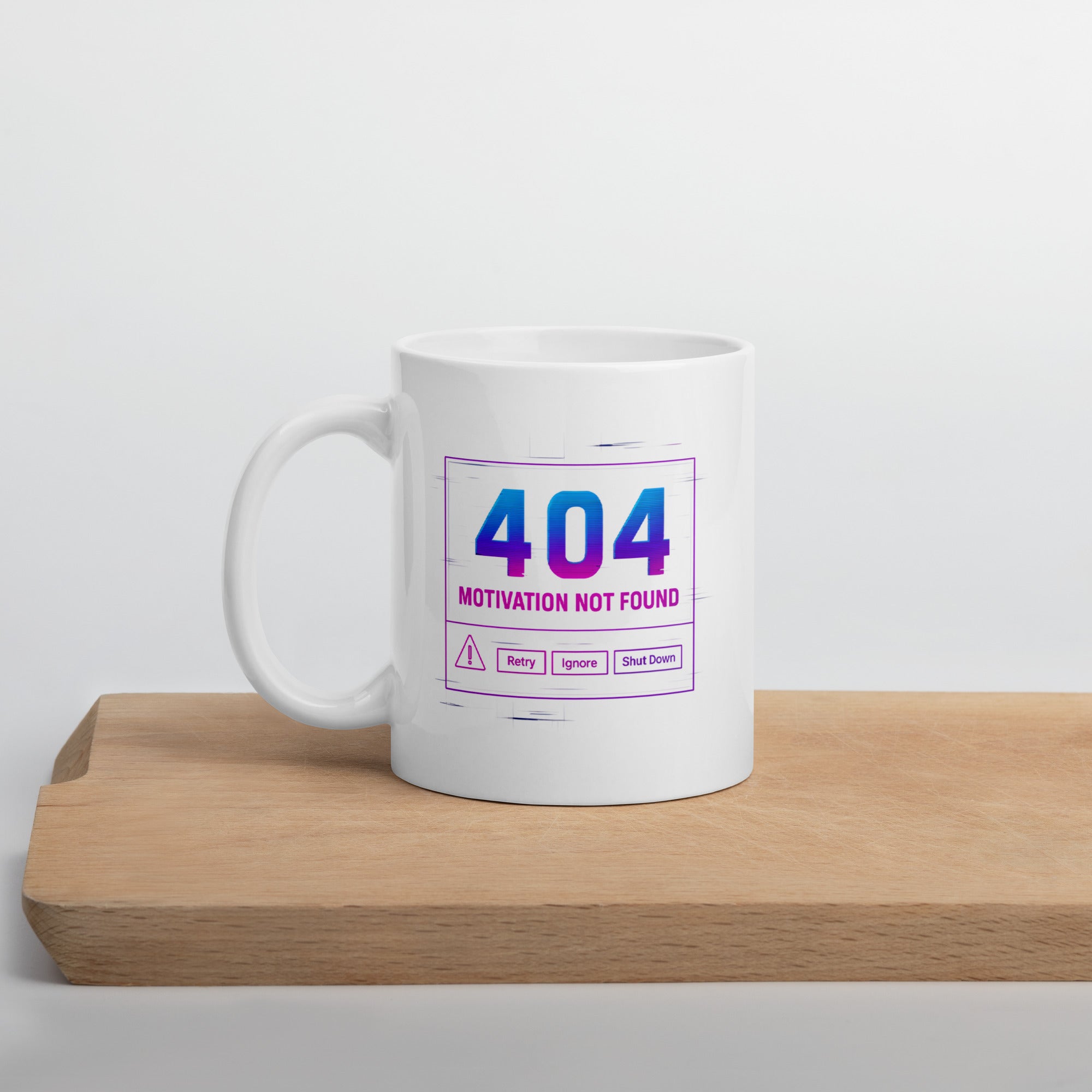 White mug with a tech-style design that reads, “404 Motivation Not Found,” resembling an error message screen.