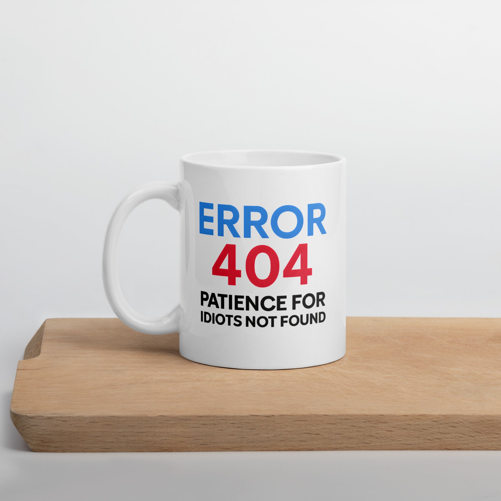 Funny coffee mug with quote “Error 404: Patience for Idiots Not Found” in blue, red, and black text.
